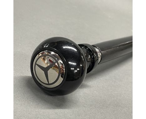 A Mercedes gear stick style walking stick.