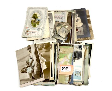 A quantity of vintage postcards and photographs.