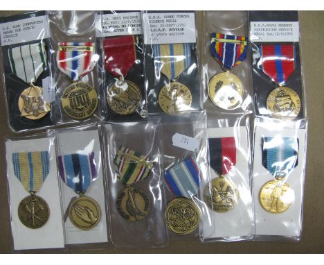 Twelve American Military Medals, including, U.S.A Navy Reserve Medal, U.S Army Commanders Award for Public Service.