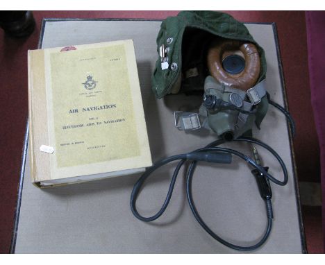 A Post War Type C Canvas RAF Flying Helmet and Oxygen Mask, plus a 1969 RAF Air Navigation Vol 3 manual.