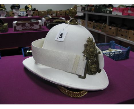 A Post War British Royal Marines White Pith Helmet and White Webbed Belt, the Pith Helmet bearing the motto "Per Mare Per Ter
