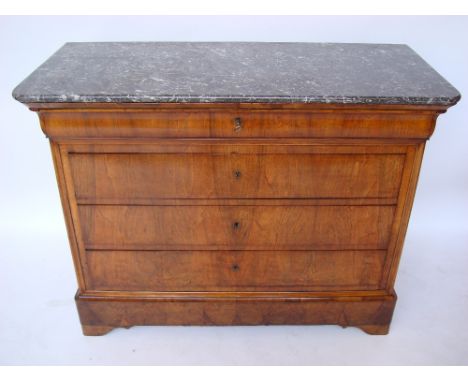 A 19th Century French Louis Philippe walnut commode, the grey marble top above a shaped frieze drawer, on plinth base.
134 x 
