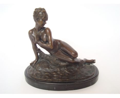 After M. Leon Bertaux.  A bronze of a reclining young woman, on oval black marble base, stamped Deposee Granti Paris J. B Dep