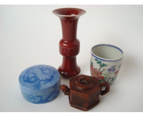 A Chinese miniature sang de boeuf glazed Gu vase, Qianlong seal mark to base, 16cm high together with a Yixing miniature hexa