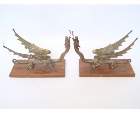 A pair of gilt bronze dragons on rectangular hardwood plinth bases. 