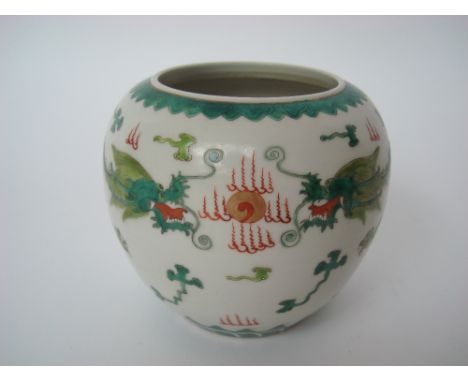 A Chinese famille verte ginger jar, decorated with scrolling dragons chasing the flaming pearl, Daoguang seal mark, 11cm high