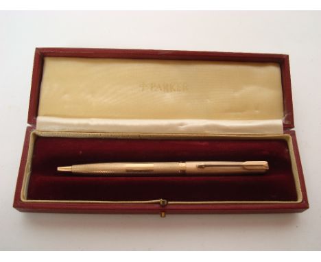 A 9 carat gold Parker ball point pen, Sheffield, 1977, engine turned, in original box. 