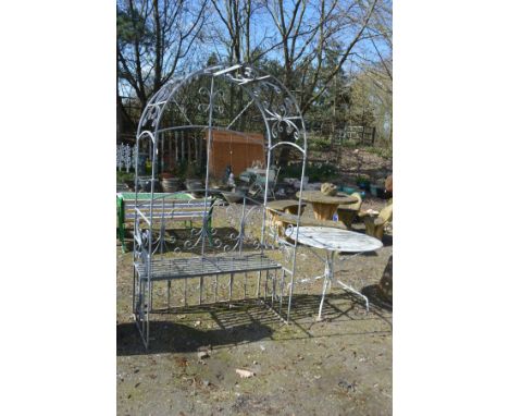 A GALVANISED METAL TWO SEATER GARDEN SEAT/ARCH with scroll motif, width 124cm x depth 62 x height 213cm together with a circu