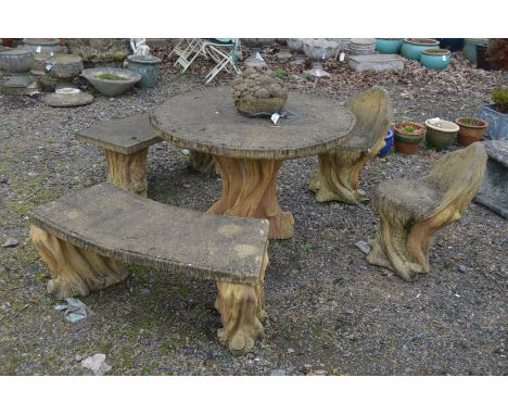 A COMPOSITE TREE TRUNK STYLE CIRCULAR GARDEN TABLE with a central moulded fruit bowl, diameter 104cm, together with a matchin