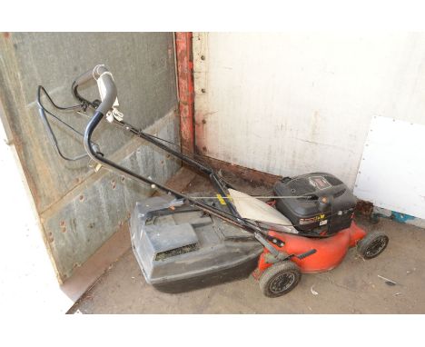 A ROVER PETROL LAWNMOWER with a Briggs and Stratton 190cc engine and grassbox