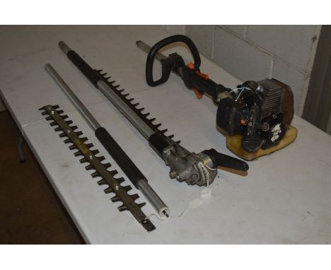 A STIHL HL75 LONG REACH MULTI ANGLED PETROL HEDGE TRIMMER, with spare shimmer attachment and pole (missing engine cover and o