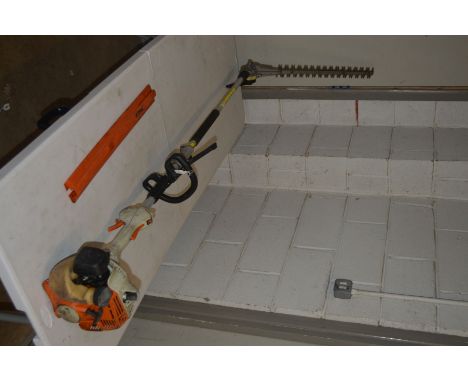 A STIHL KM55R KOMBI ENGINE MULTI PETROL TOOL with 19’’ angled hedge trimmer attachment (pulls but doesn’t fire)