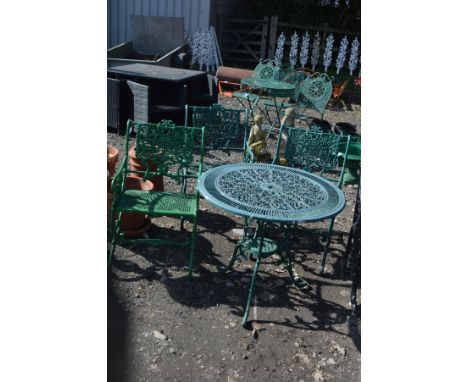 A GREEN PAINTED CIRCULAR ALUMINIUM GARDEN TABLE with foliate decoration, diameter 80cm x height 69cm together with three simi