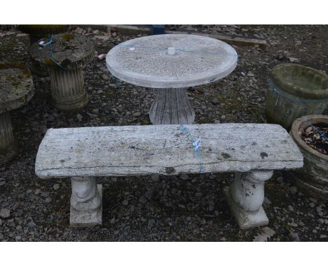 A CIRCULAR COMPOSITE GARDEN TABLE with foliate decoration, diameter 66.7cm x height 65cm  together with composite garden benc