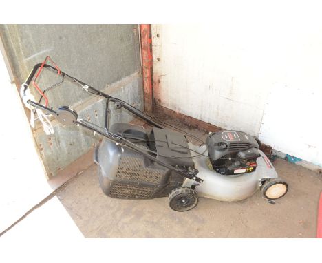 A LAWN KING PETROL LAWNMOWER with a Briggs and Stratton 158cc engine and grassbox