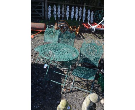 A PAINTED WROUGHT IRON FOLDING GARDEN TABLE with lattice detail, diameter 69cm x height 75cm together with three matching fol