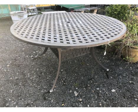 A CIRCULAR ALUMINIUM LATTICE TOPPED GARDEN TABLE, diameter 152.5cm x height 72cm