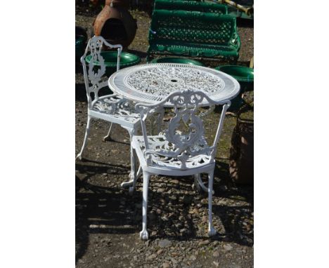 A PAINTED CIRCULAR ALUMINIUM GARDEN TABLE with foliate decoration, diameter 81cm x height 70cm together with two similar chai