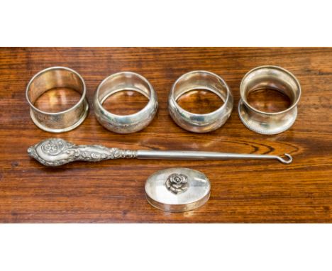 A pair of silver napkin rings, chased foliate scroll decoration, hallmarked Birmingham 1921 E.R. Brothers, two further silver
