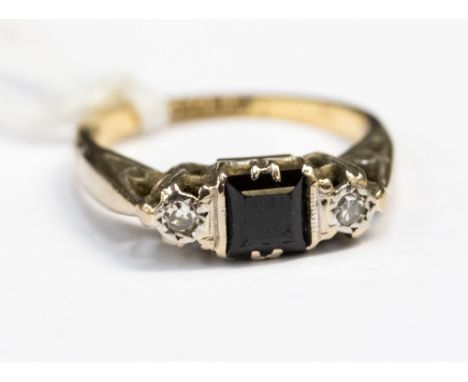 A sapphire and diamond 18ct yellow gold and platinum set ring, the square step cut sapphire, set between two small illusion s