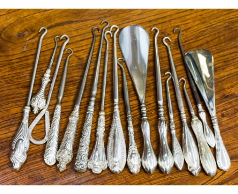 Sixteen various silver and plated handled button hooks 