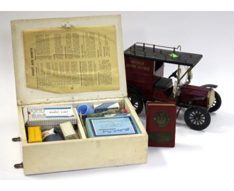 A 'Arthur Henry Tucker' Ford model car, together with a 'Nottingham Savings Bank' money box and a vintage First Aid box with 