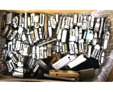A box containing a collection of various pocket lighters, including Ronson and many others, some with engine turned decoratio