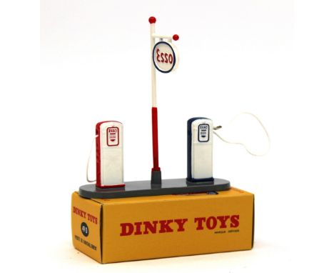 Dinky: A French Dinky Toys No.49d "Esso" Petrol Pump Set, finished in grey, white, red, blue, contained within original yello