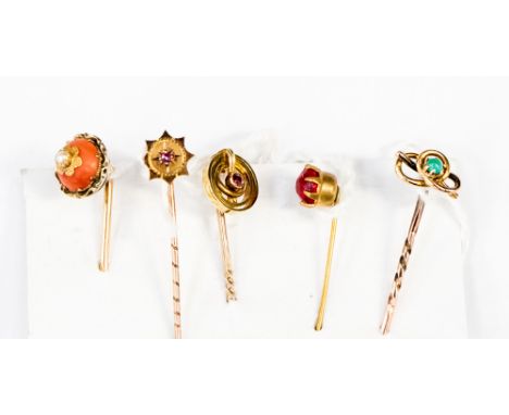 A card of 5 stick pins, one coral, set with pearl, some set with garnets 