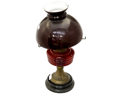 A late 19th/early 20th Century oil lamp, the shade (af) 