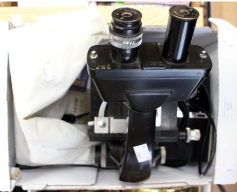 A Vickers Instruments electric microscope, with light source, slides, cover, etc 