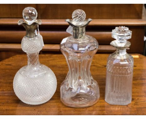 A silver mounted glass decanter, flared silver rim, Birmingham, 1886, makers mark for J.G & S, together with a Silver mounted