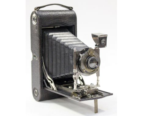A 1916 cased Kodak American bellows camera.
