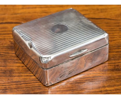 A silver cigarette box, engine turned stripes, indistinct Birmingham hallmark/maker dents 