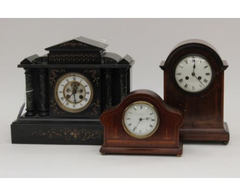 A marble mantle clock, white dial with black Roman numerals, gilt double chapter ring, two marble pillars either side and gil