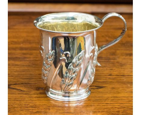 A late Victorian silver mug, embossed with wheat motifs, inscribed Harvey Pager, July 25th 1942, Harrison Brothers and Howson