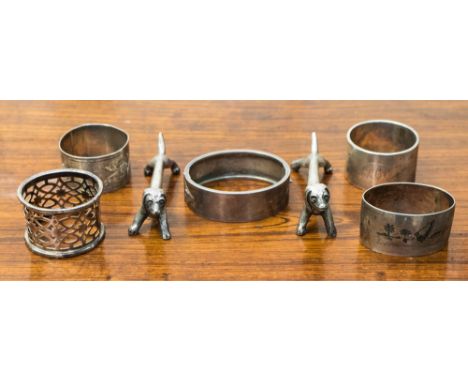Two silver napkin rings, total gross weight approximately 82.8 grams/ 2.66 ozt,a silver engraved bangle, gross weight approxi
