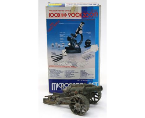A large Britains WWI field gun and a 100-900 zoom microscope set 