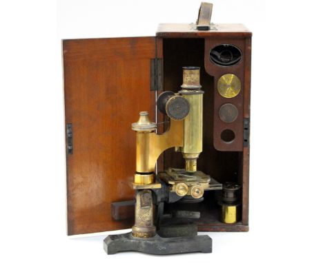 Ross London: A lacquered brass and black enamelled monocular microscope, signed `Ross, London, 8601`, with rack and pinion fo