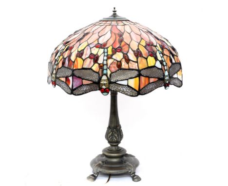 A Tiffany style lamp and shade, the shade having Dragonfly pattern on red ground, Spelter base on four ball feet 
