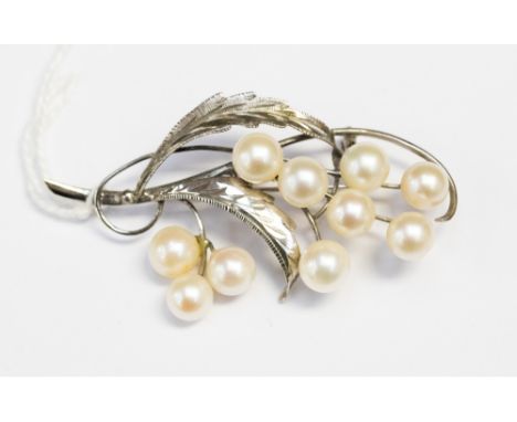 A 14ct white gold cultured pearl brooch, floral form, length approximately 55mm (clasp broken), total gross weight approximat