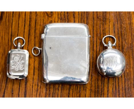 An early 20th century silver vesta, William H Haseler, Birmingham 1912, a white metal pill box and a silver sovereign holder 