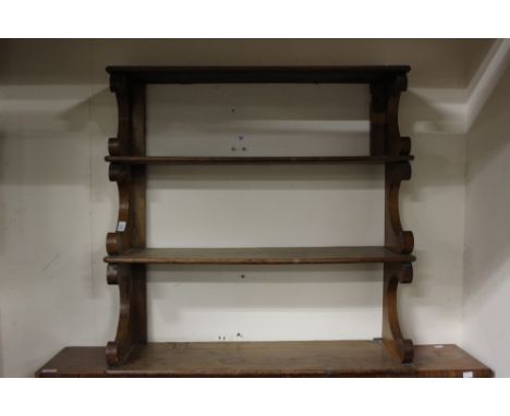 A 19th Century three tier wall hanging mahogany shelf unit, 82cm high, 83cm wide, 27cm deep