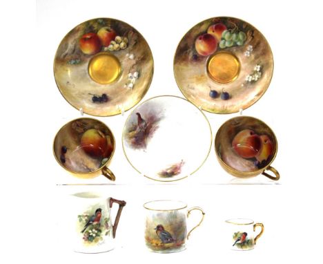 A Royal Worcester cabinet cup and saucer, the interior of the cup and saucer hand painted with fruit to a mossy ground by Ric
