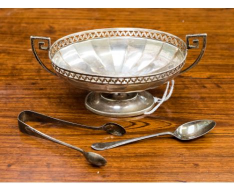 An early 20th century raised bon bon dish with pierced double key pattern to rim and key pattern twin handles, Robert and Bel