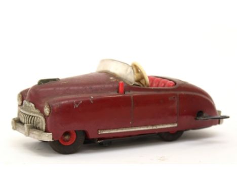 Schuco: A Schuco (made in U.S-Zone Germany) "Radio" 4012, maroon open car, clockwork, red seats, lithographed dashboard, plat