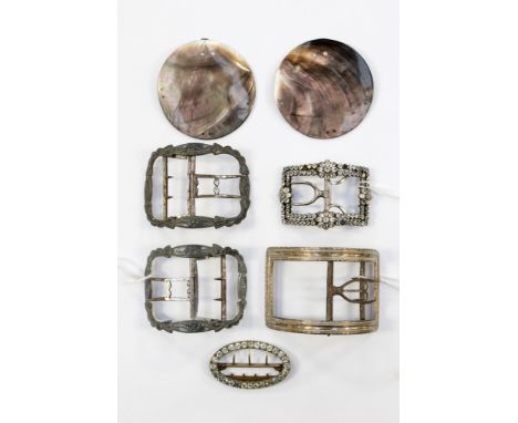 A Regency silver and steel shoe buckle, also a pair of steel and white metal buckles, a steel and diamante buckle, a white me