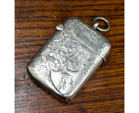 An early Edward VII silver vesta case with foliate decoration and engraved initials, hallmark Birmingham 1903, maker William 