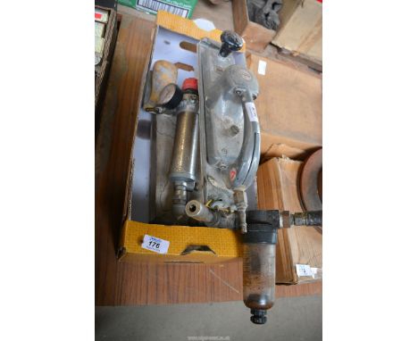 A box containing an Air regulator and a "Desoutter" pneumatic sander.