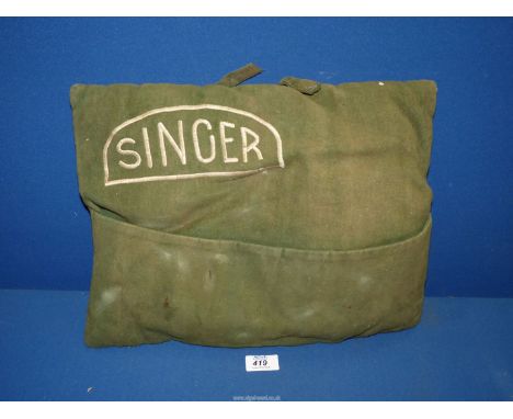 A vintage Singer car cushion in green, handle as found (some stains).